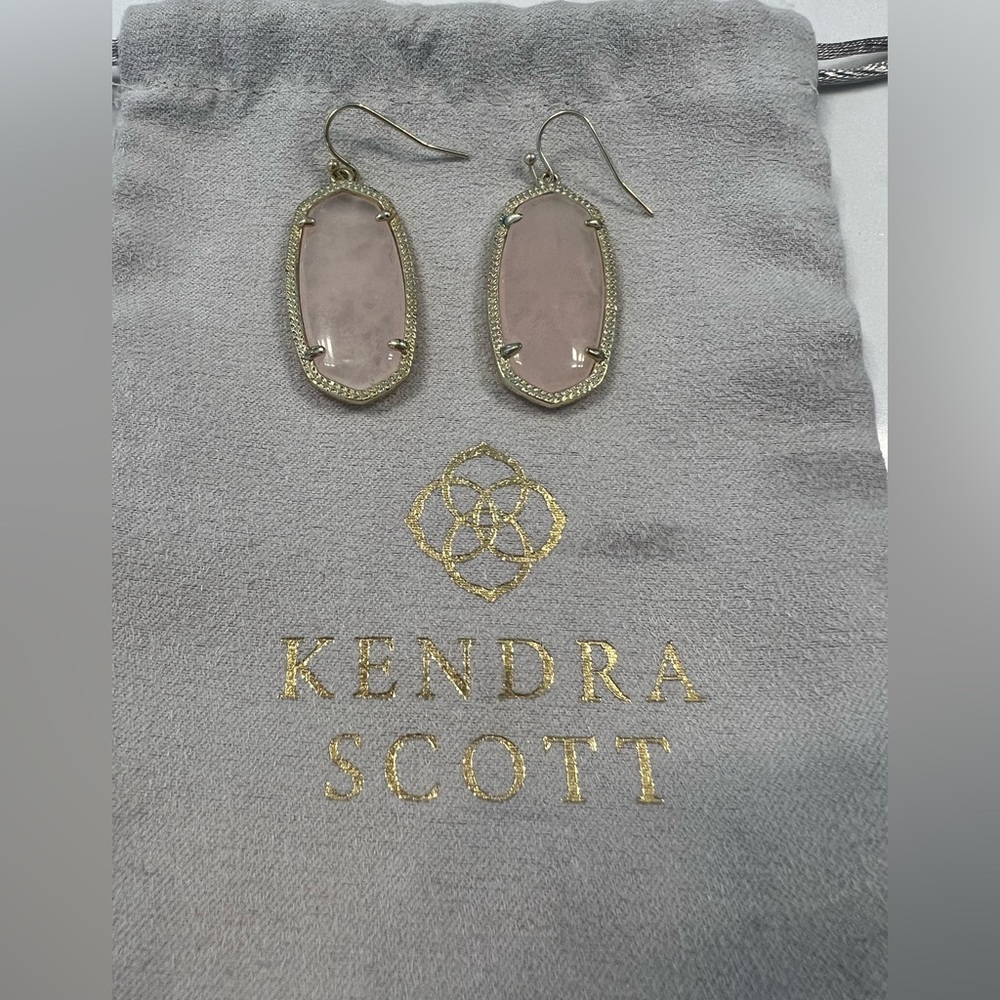 Kendra Scott rose quartz earrings.